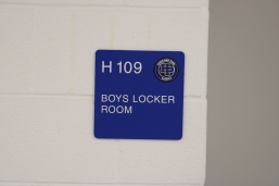 Highland Park High School (Highland Park, IL); ADA Tactile & Braille Room Sign with HP Crest