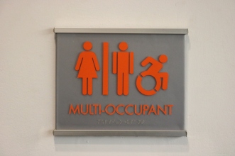 MTTC Building (Illinois Institute of Technology, Chicago); ADA Tactile and Braille Multi-Occupant Restroom Sign + Satin Aluminum Frame